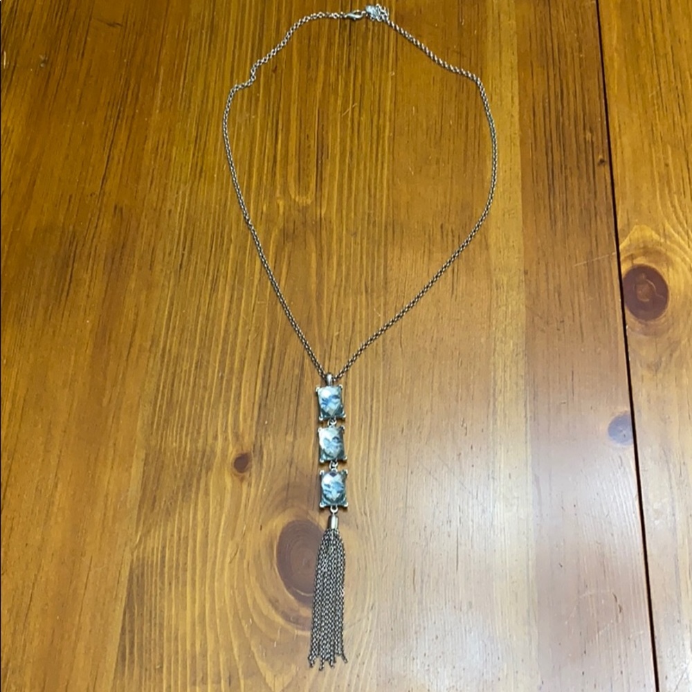 Silver large clear stones w/ blue flower in them.